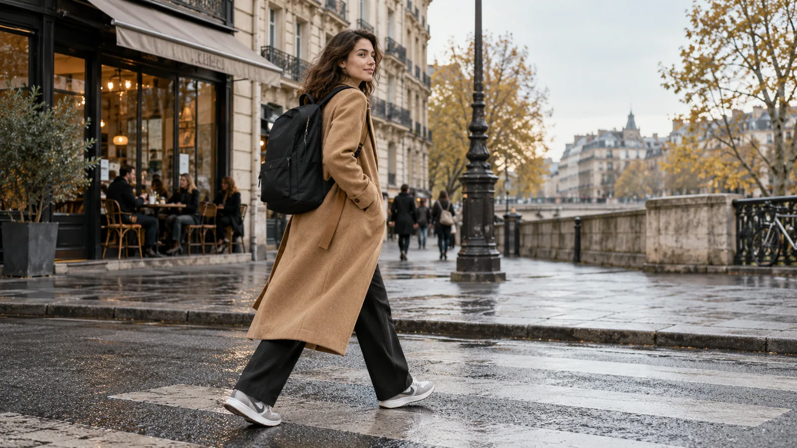 Creative professional wearing a sleek backpack with a tailored coat